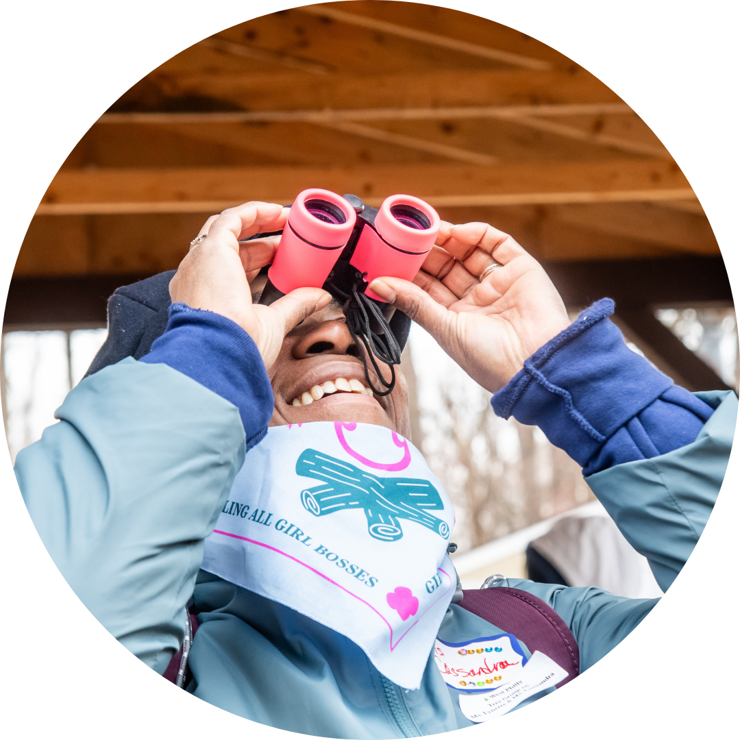 Girl Boss looking through binoculars
