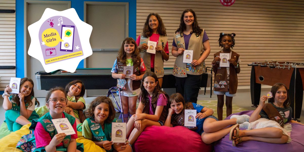 Media girls smiling and posing with their Media Girl patches
